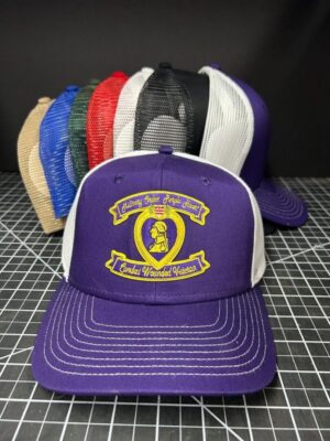 Colorful trucker hats displayed in a row.