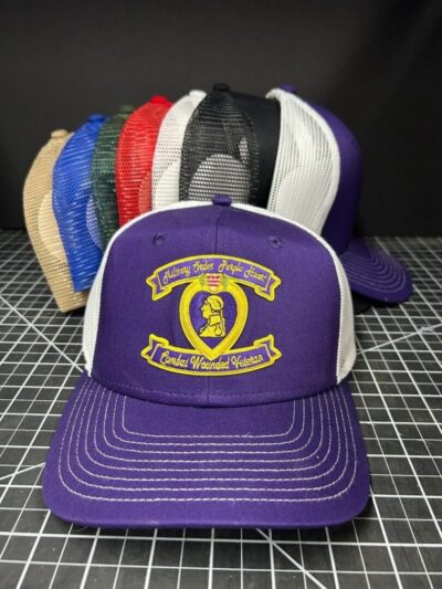 Colorful trucker hats displayed in a row.