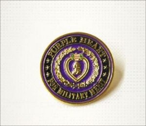 Purple Heart military medal pin on display.