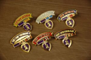 Military veteran pins with Purple Heart medals.