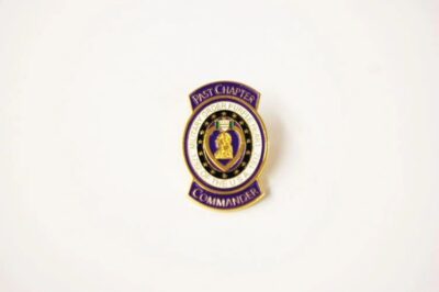 Past Chapter Commander badge on white background.