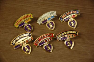 Military veteran pins with Purple Heart medals.