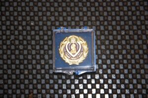 Purple Heart medal in a display case.