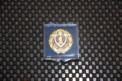 Purple Heart medal in a display case.
