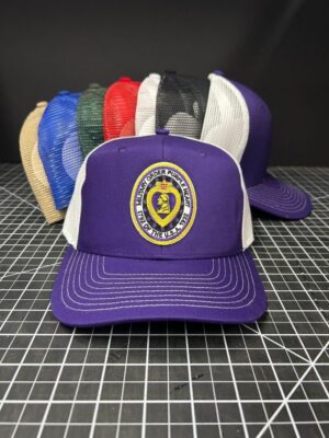 Purple cap with emblem, other caps behind.