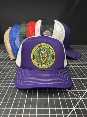 Purple hat with United States Army emblem.