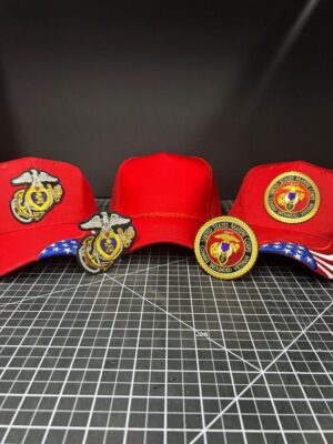 Three red caps with military patches.