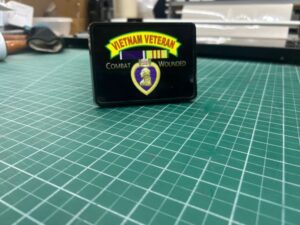 Vietnam Veteran badge on cutting mat.