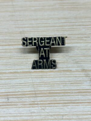 Sergeant at Arms badge on surface.