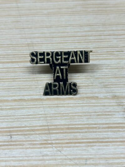 Sergeant at Arms badge on surface.