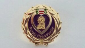 Purple Heart Family medal with laurel wreath.