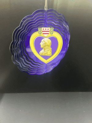 Purple heart-shaped medal with profile portrait.