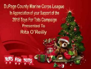 Christmas tree with Toys for Tots message.