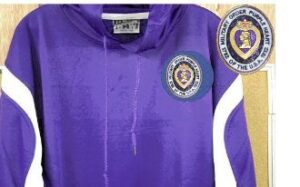 Purple hoodie with military insignia patch.