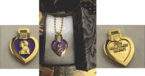 Heart-shaped military medal with purple design.