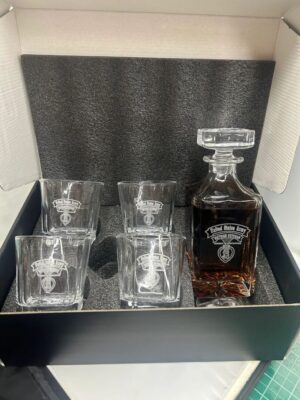 Whiskey decanter set with four glasses.