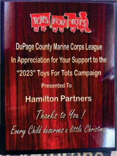 Plaque honoring Toys for Tots support.