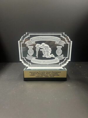 Engraved military award with Purple Heart design.