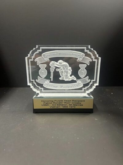 Engraved military award with Purple Heart design.