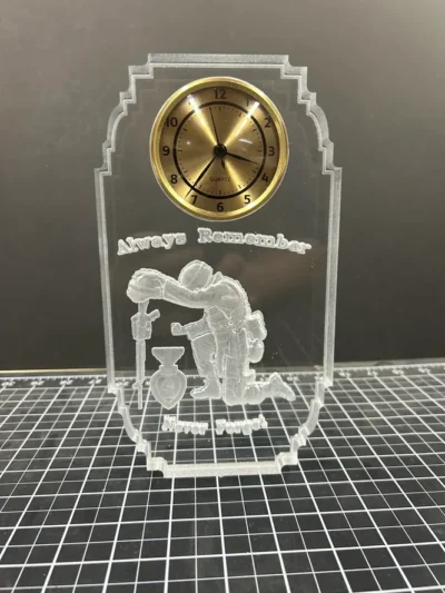 Acrylic clock with firefighter engraving and text.